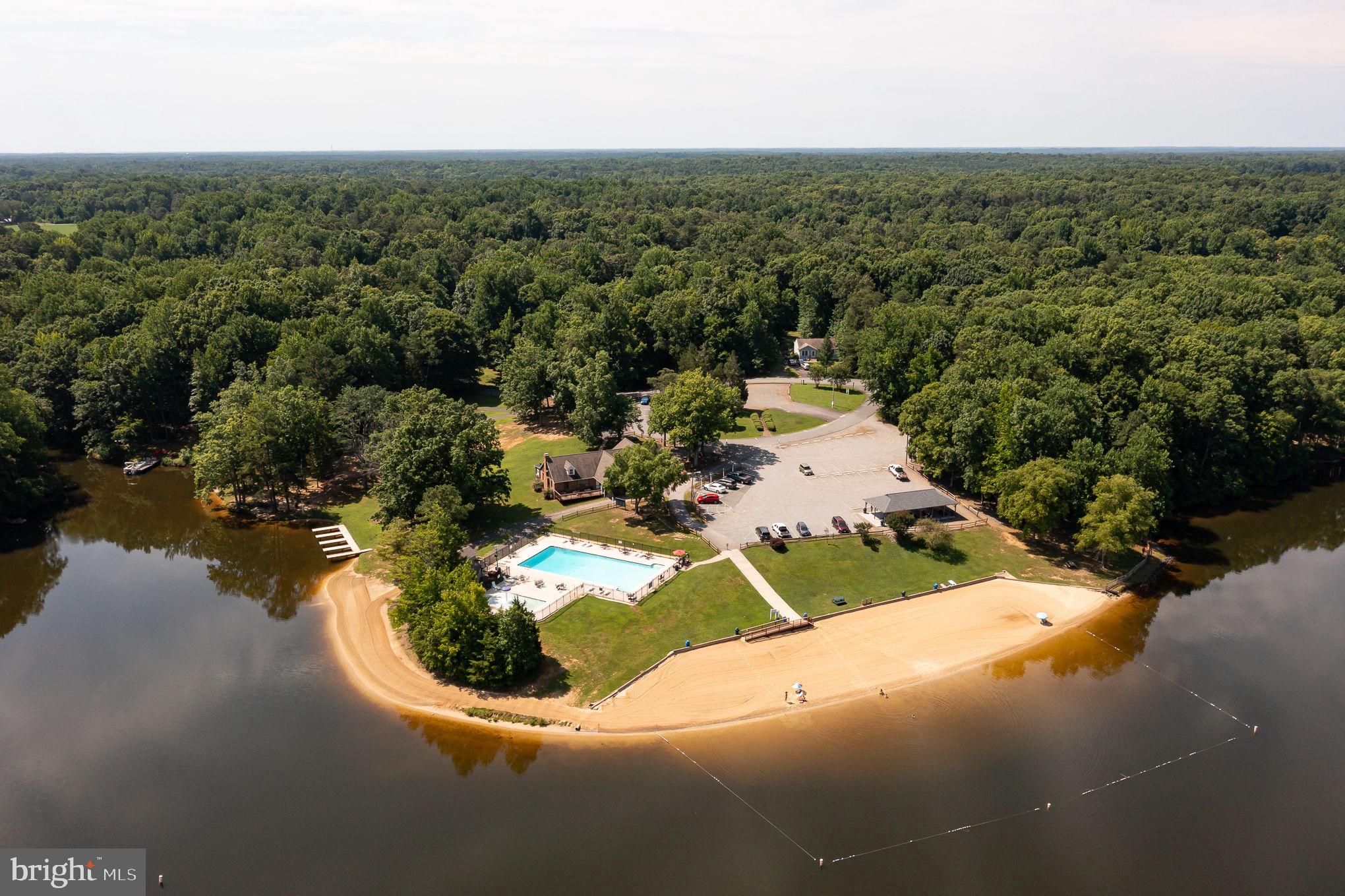 227 Cedar Ridge Drive Ruther Glen, VA 22546 - Photo 39 of 44 an aerial view of a house with a yard and lake view