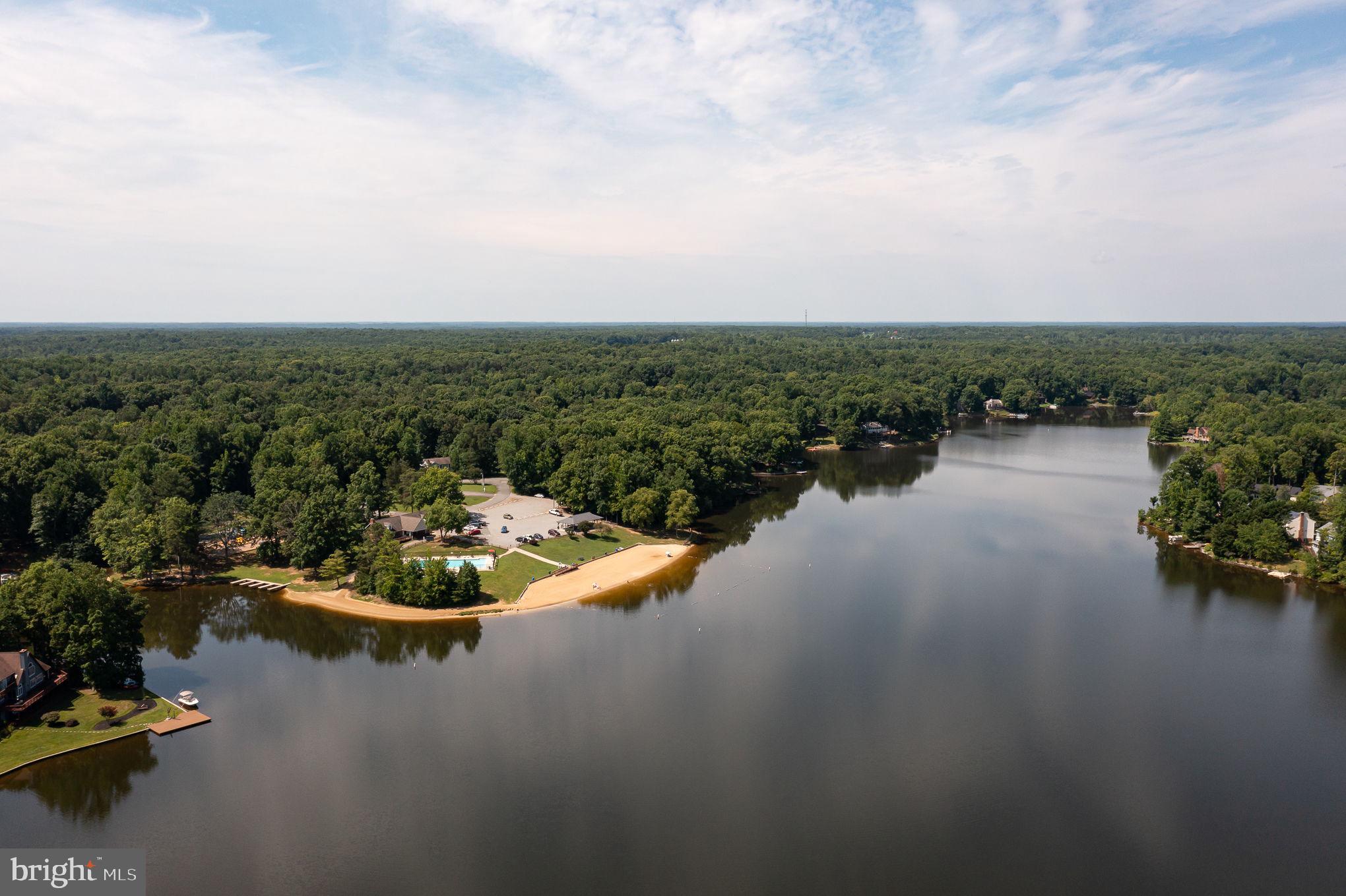 227 Cedar Ridge Drive Ruther Glen, VA 22546 - Photo 40 of 44 a view of a lake with a city