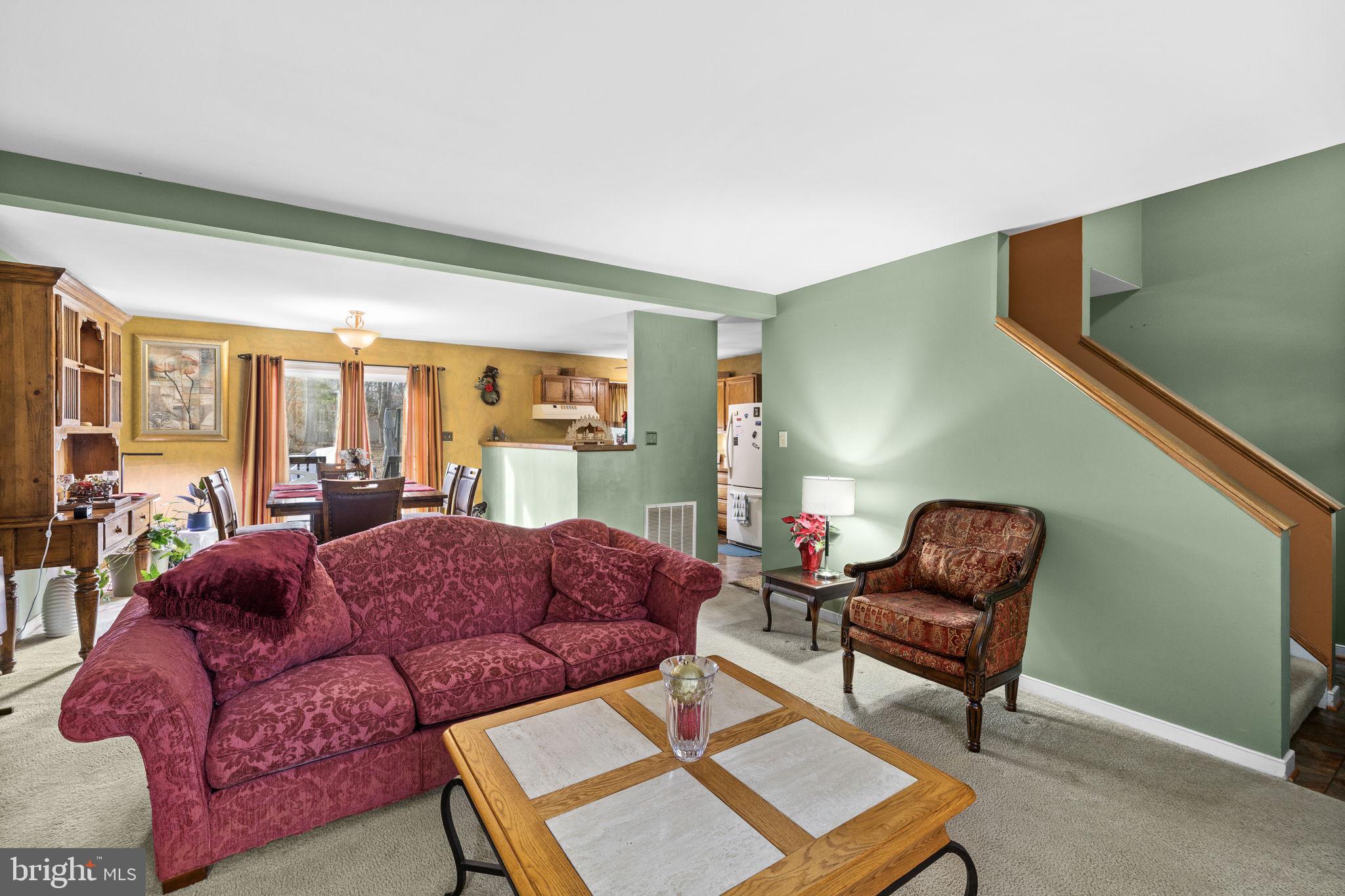 227 Cedar Ridge Drive Ruther Glen, VA 22546 - Photo 6 of 44 a living room with furniture and a window