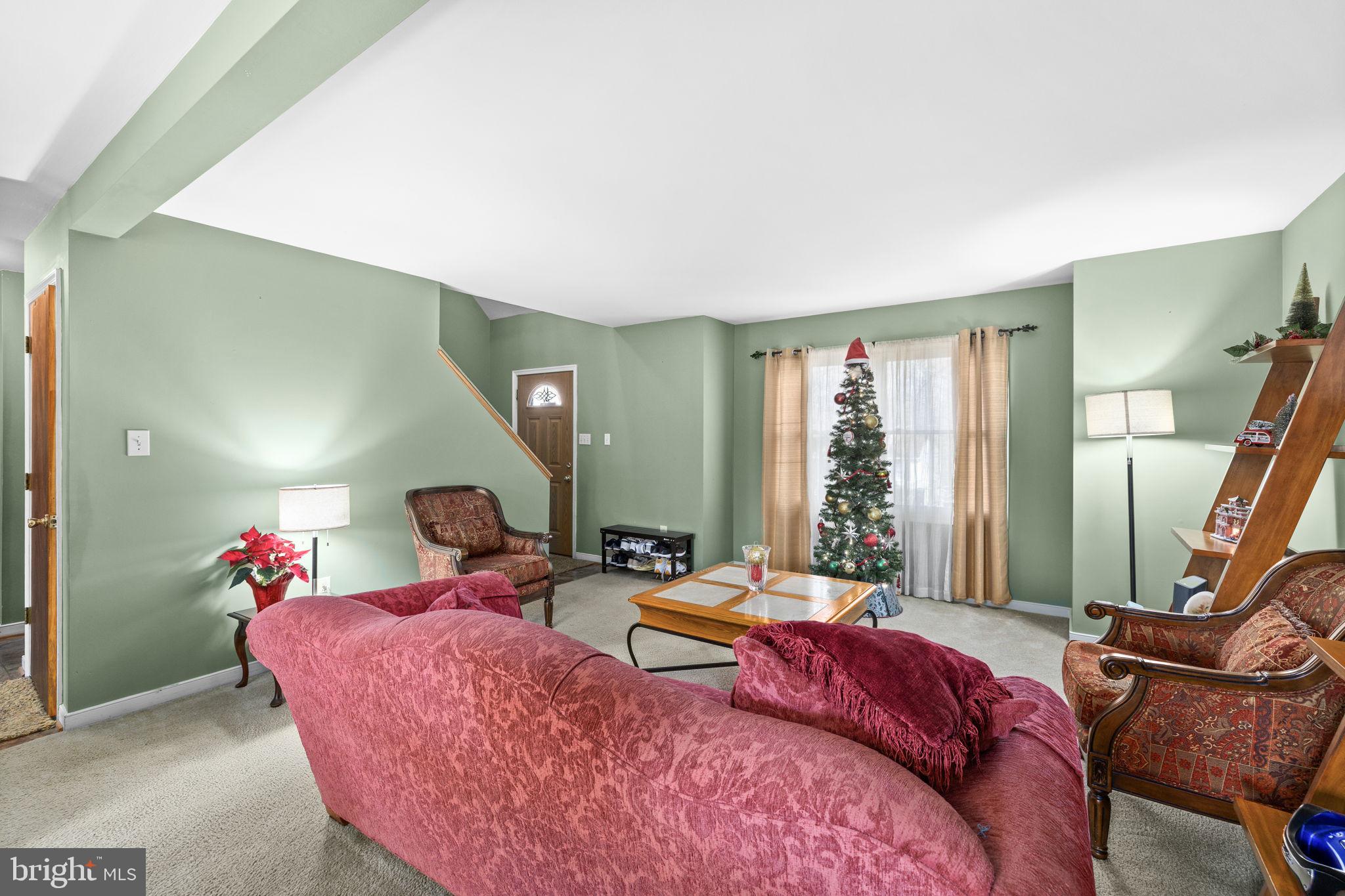 227 Cedar Ridge Drive Ruther Glen, VA 22546 - Photo 8 of 44 a living room with furniture or couch and a potted plant