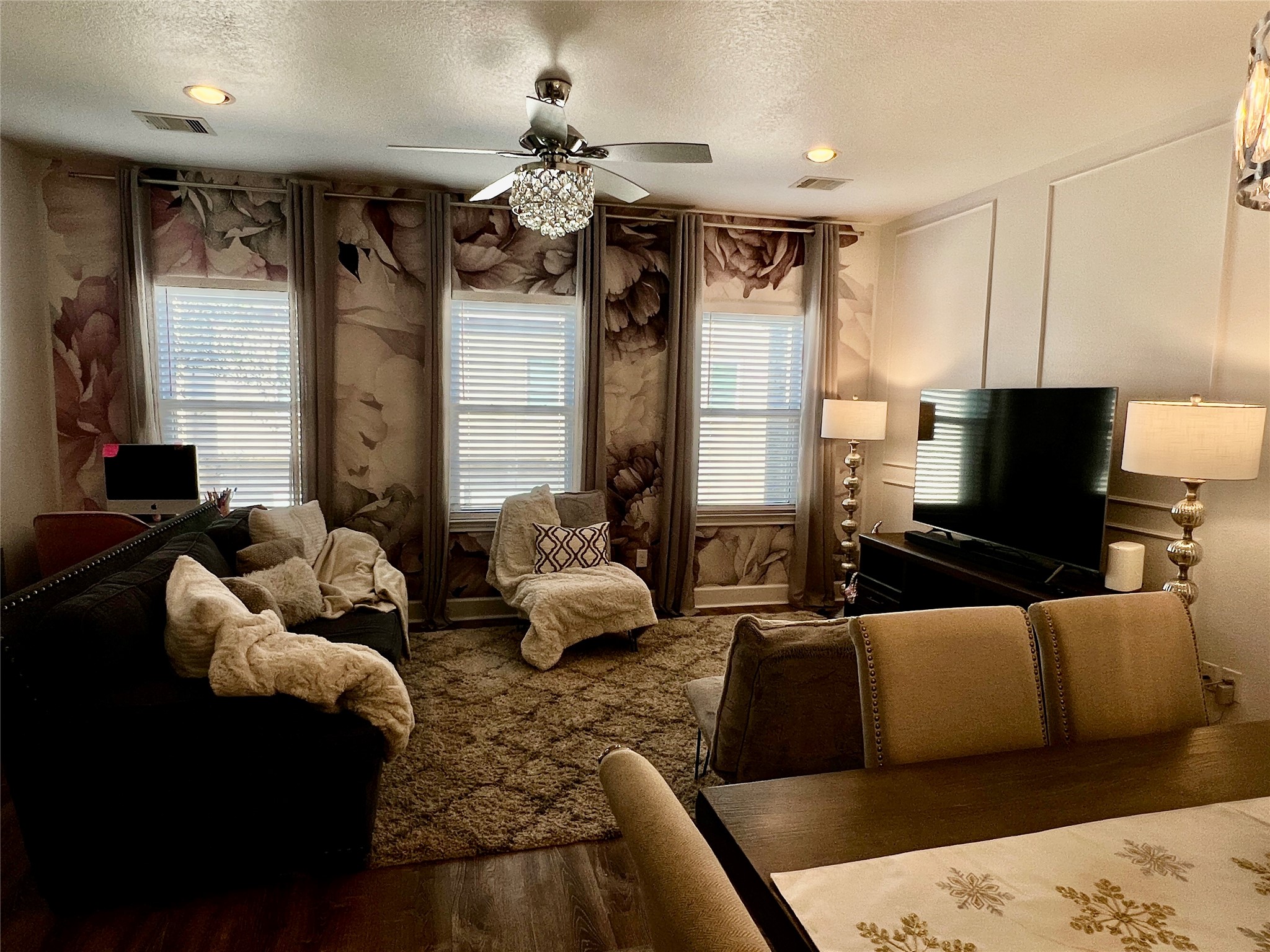 312 Mission Lane Houston, TX 77011 - Photo 5 of 19 a living room with furniture and a flat screen tv