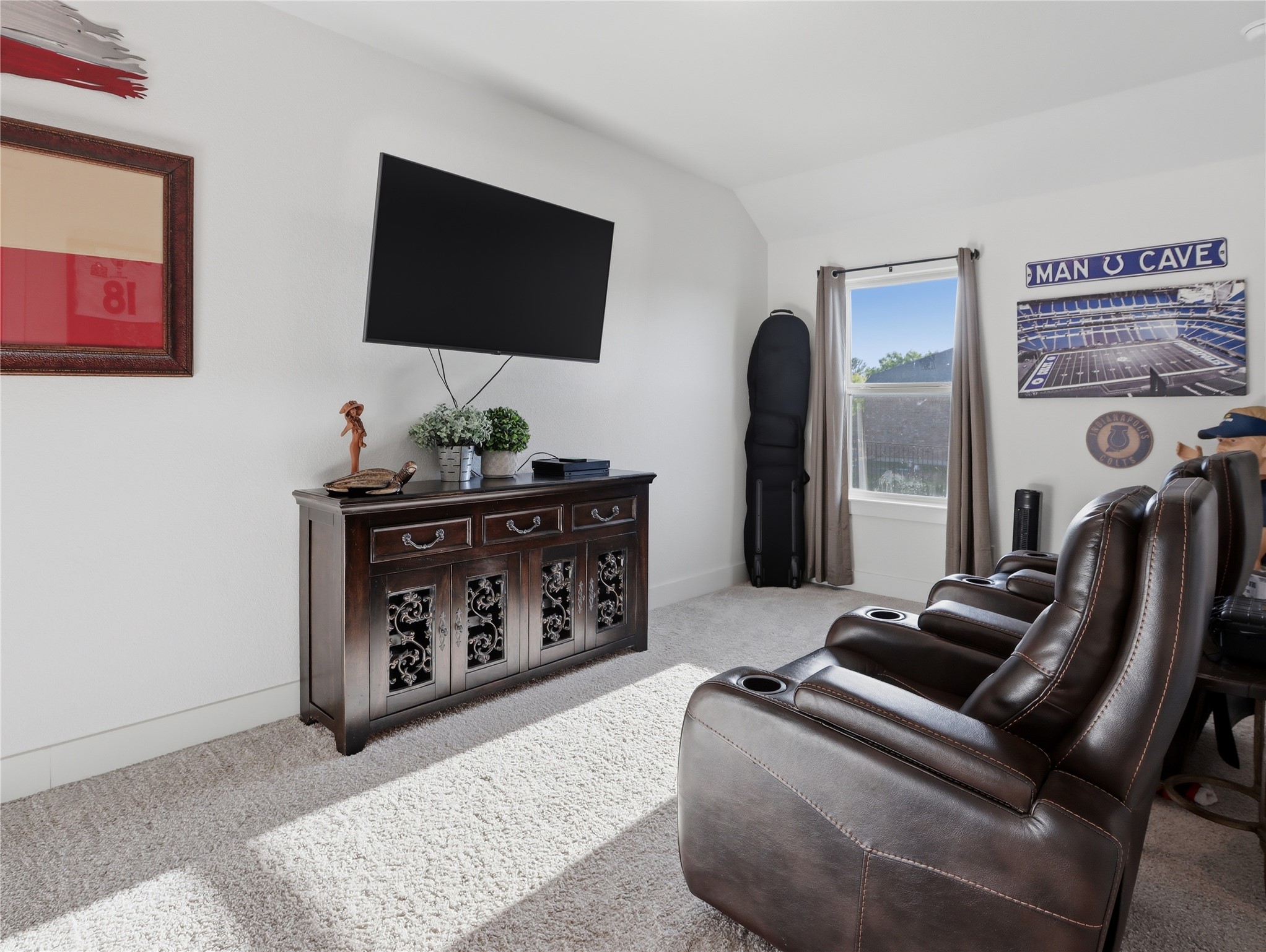 316 Raptor Beak Way Cedar Creek, TX 78612 - Photo 25 of 30 a living room with furniture and a flat screen tv