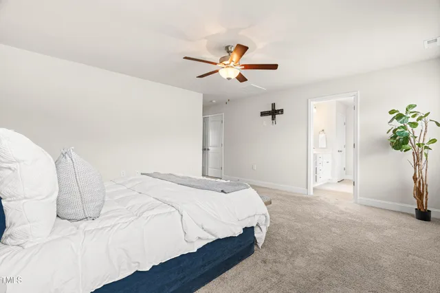 a bathroom with double vanity sink a mirror and a shower