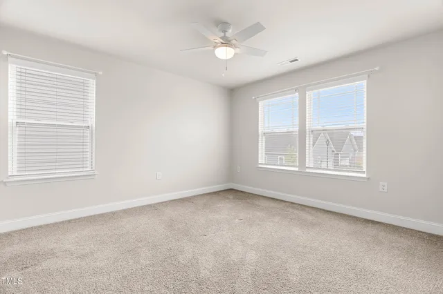 a white bath tub sitting next to a window