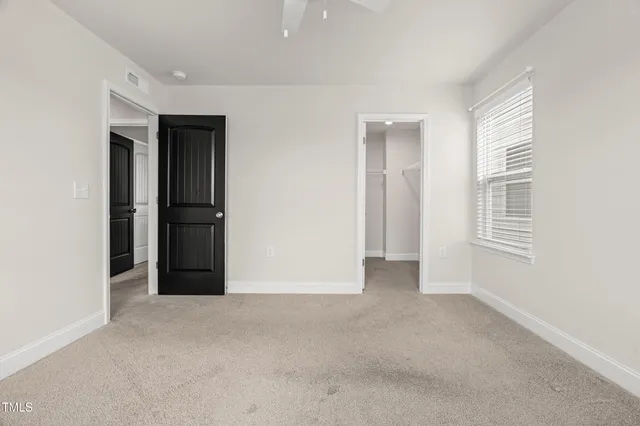 a view of a house with pool and a yard