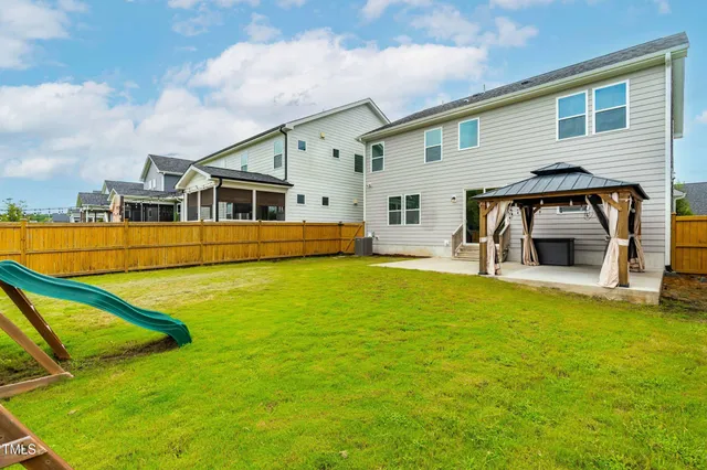 a view of a park with large trees