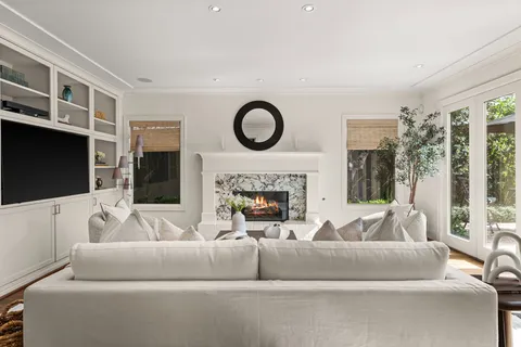 a living room with furniture and a rug