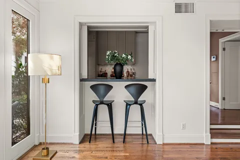 a bathroom with a granite countertop sink mirror and shower