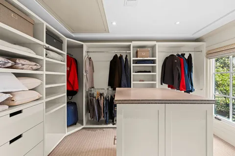 a bedroom with bed and window