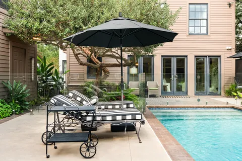 a living room with furniture and a book shelf