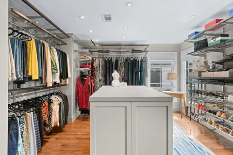 a kitchen with a stove top oven and cabinets