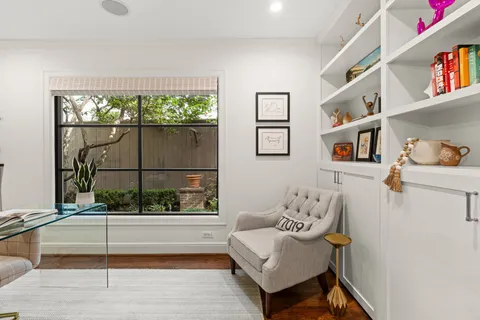 a view of house with swimming pool and sitting area