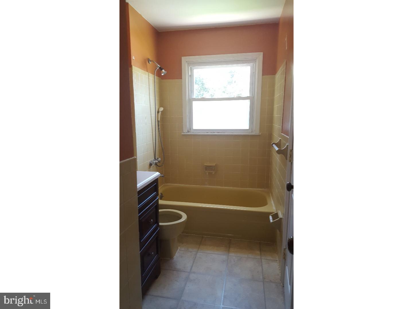 58 Elmont Road Trenton, NJ 08610 - Photo 14 of 20 a bathroom with a toilet and a bathtub