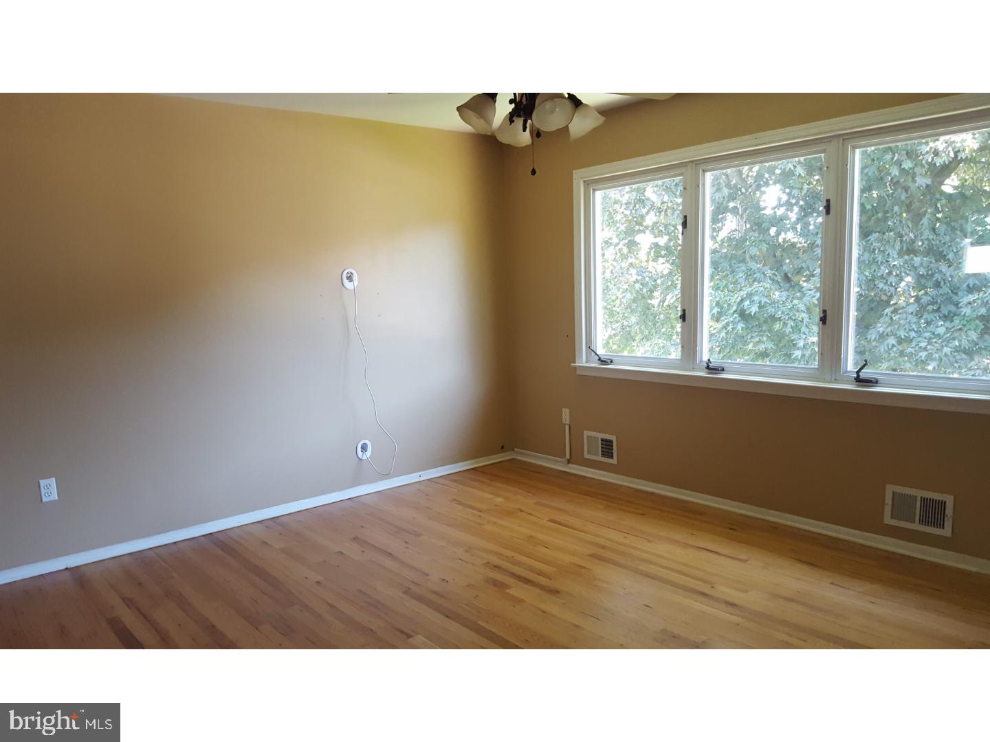 58 Elmont Road Trenton, NJ 08610 - Photo 6 of 20 a room with a window and ceiling fan
