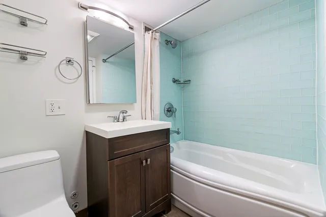 a bathroom with a sink a toilet and a bathtub