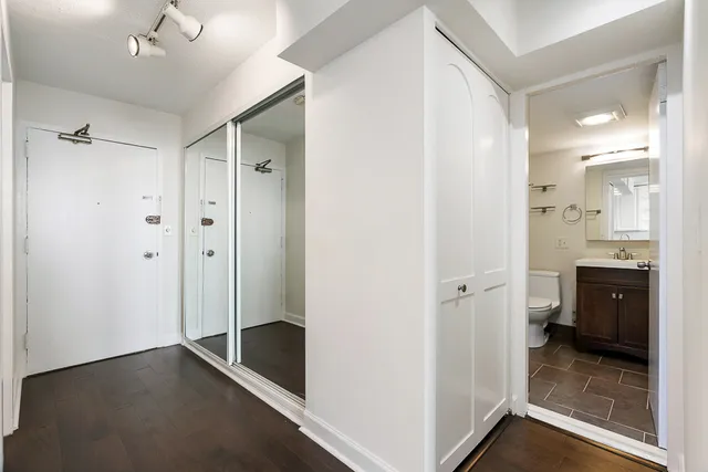 a bathroom with a shower and a sink