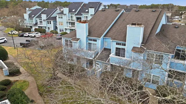 an aerial view of a city with lots of residential buildings