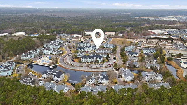 a aerial view of a house with a lake view