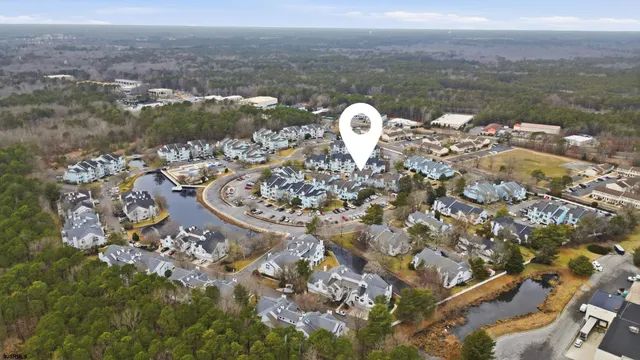 a view of a house with a yard and tree s