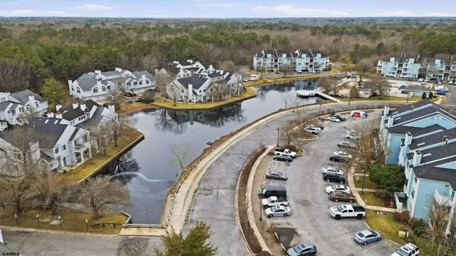 a view of swimming pool with outdoor seating and city view