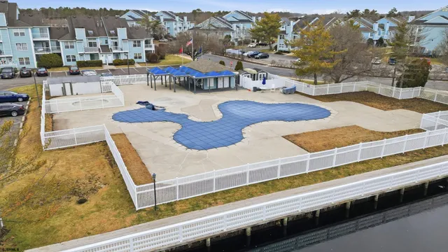 a view of a swimming pool with a table and chairs