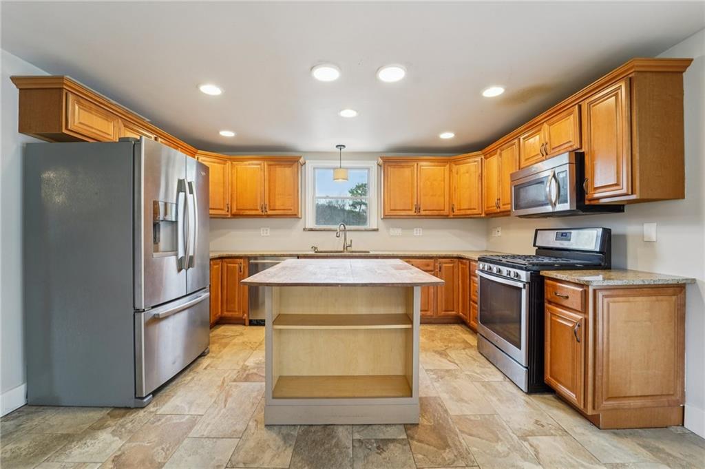 6012 Cunningham Road Gibsonia, PA 15044 - Photo 6 of 26 a kitchen with stainless steel appliances granite countertop a refrigerator a stove a sink and a microwave