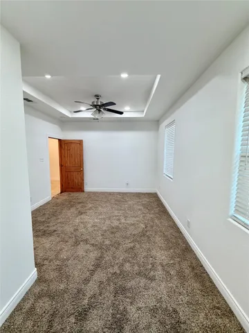 a bathroom with a sink toilet mirror and shower