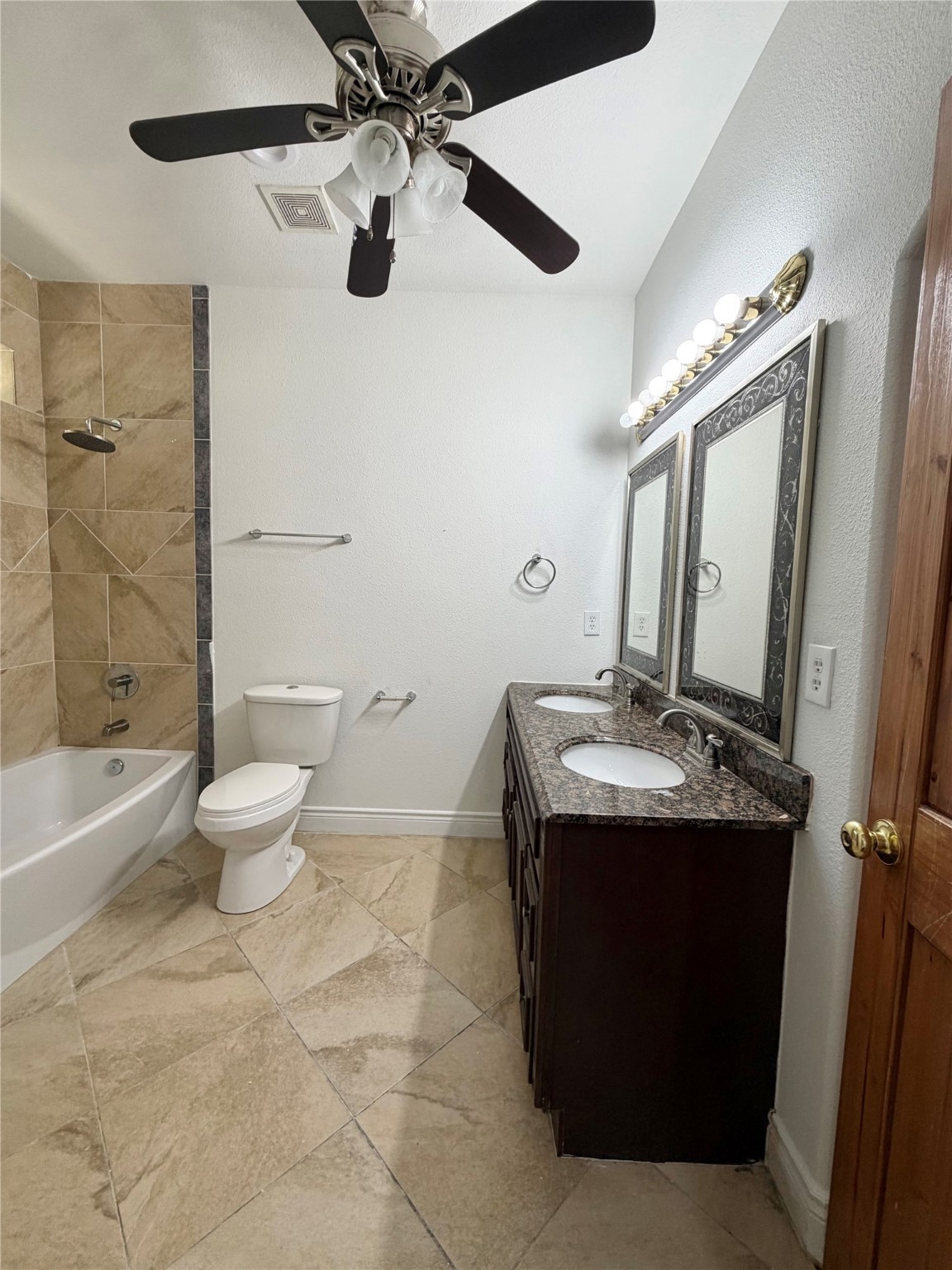 1530 Dearing Street Port Neches, TX 77651 - Photo 15 of 28 a bathroom with a sink toilet mirror and shower