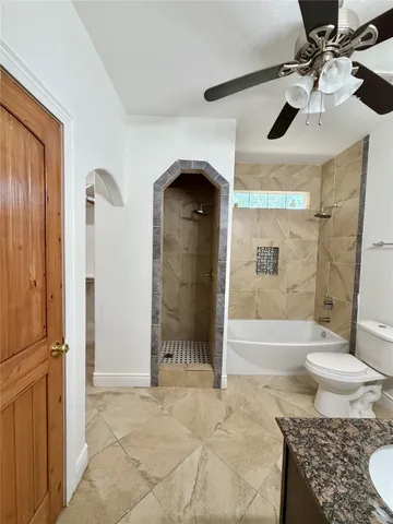 a view of a kitchen with a sink and cabinets