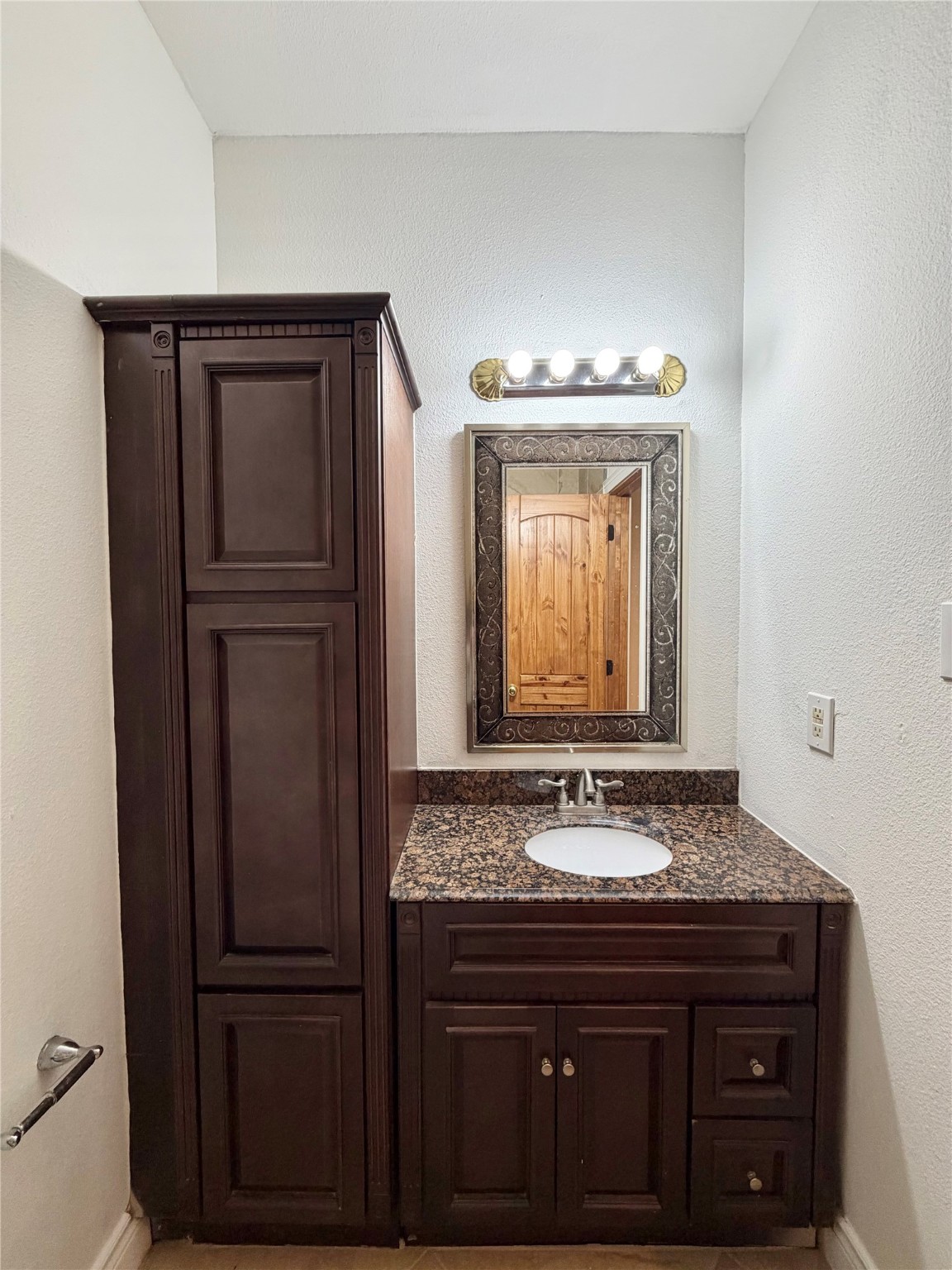 1530 Dearing Street Port Neches, TX 77651 - Photo 23 of 28 a bathroom with a sink and a mirror