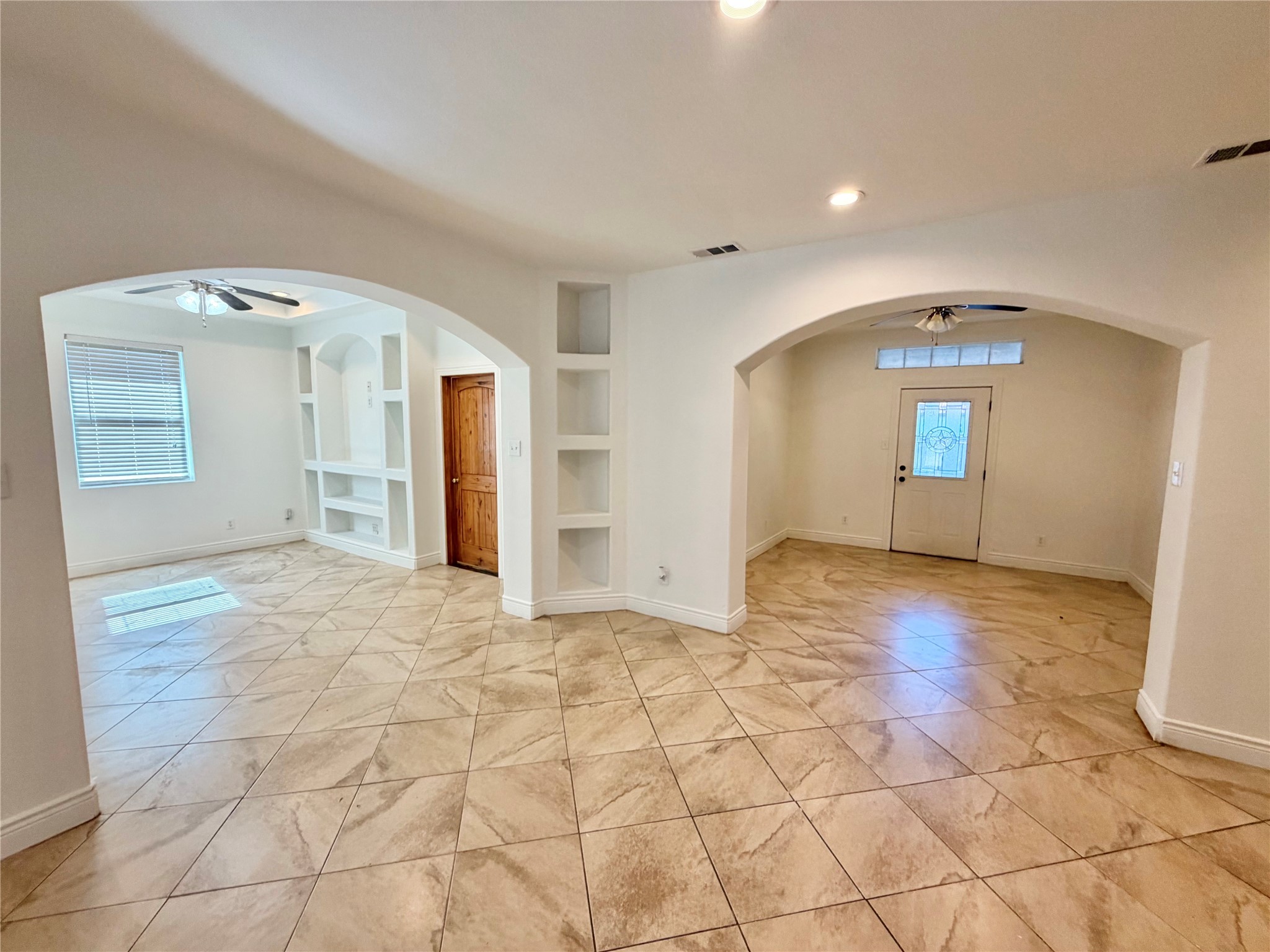 1530 Dearing Street Port Neches, TX 77651 - Photo 6 of 28 a view of a livingroom with wooden floor and kitchen space