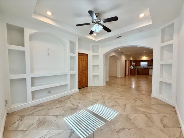 a view of livingroom with an empty space and a window