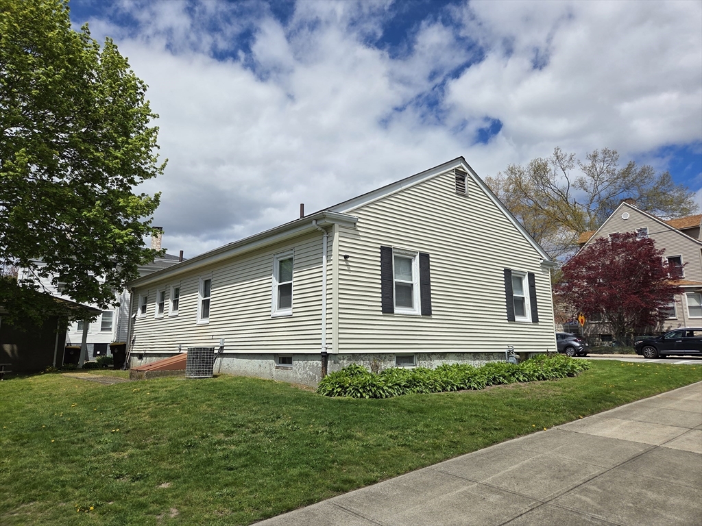 499 Maple Street Fall River, MA 02720 - Photo 3 of 21 a front view of house with yard and green space