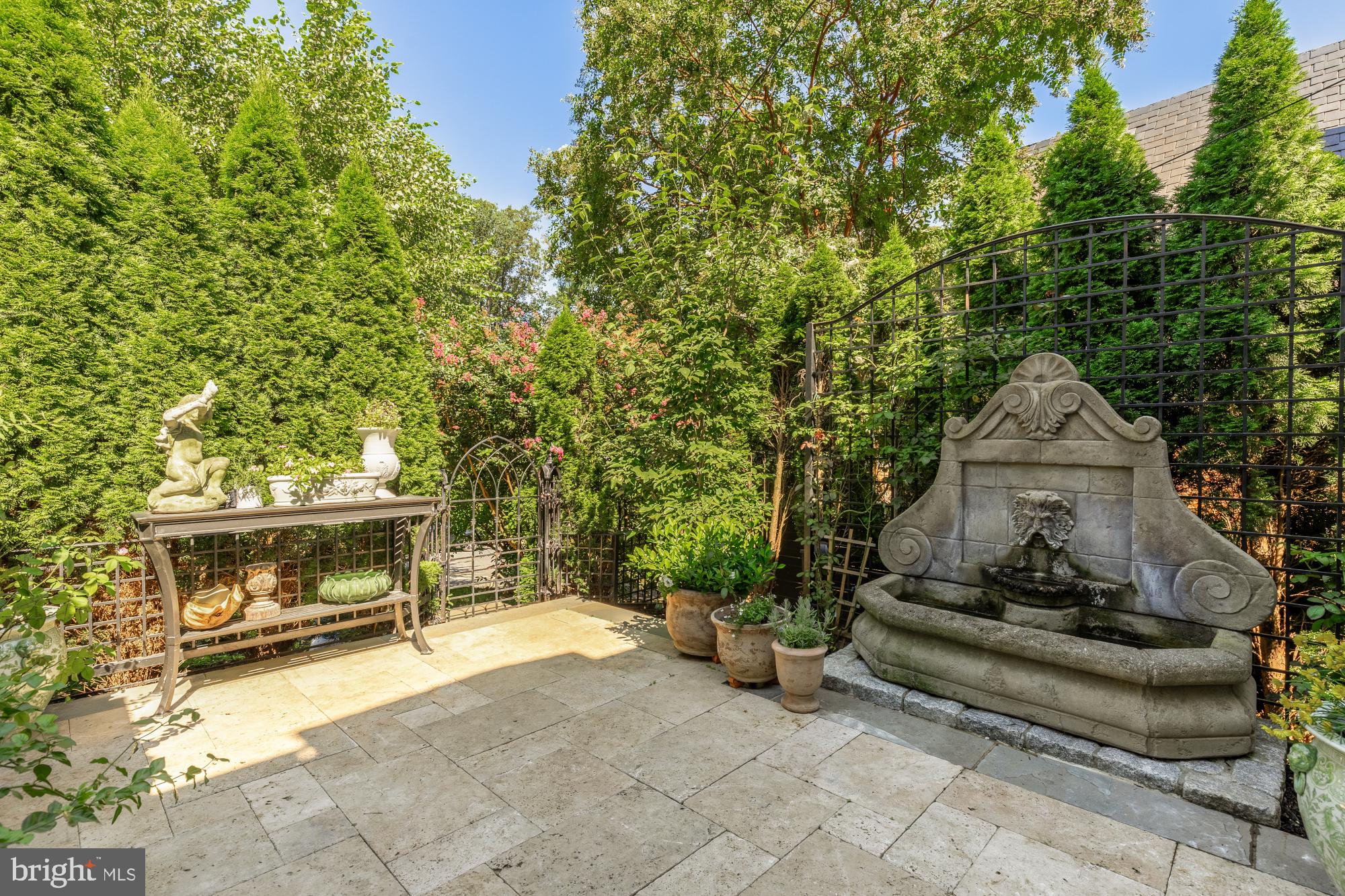 3110 Rolling Road Chevy Chase, MD 20815 - Photo 11 of 64 a front view of a house with a garden