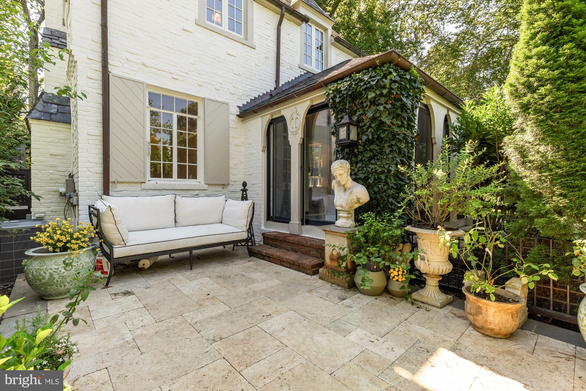 3110 Rolling Road Chevy Chase, MD 20815 - Photo 12 of 64 a view of a patio with couches and potted plants
