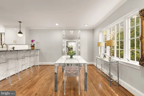 a view of a kitchen with an empty space and a window