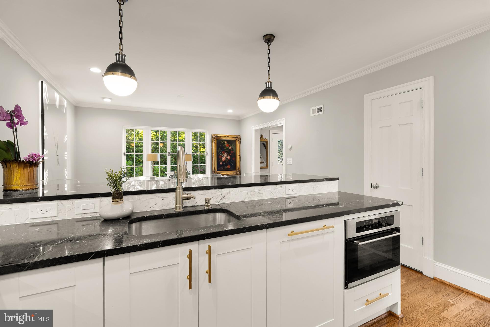 3110 Rolling Road Chevy Chase, MD 20815 - Photo 21 of 64 a kitchen with granite countertop a sink and a window