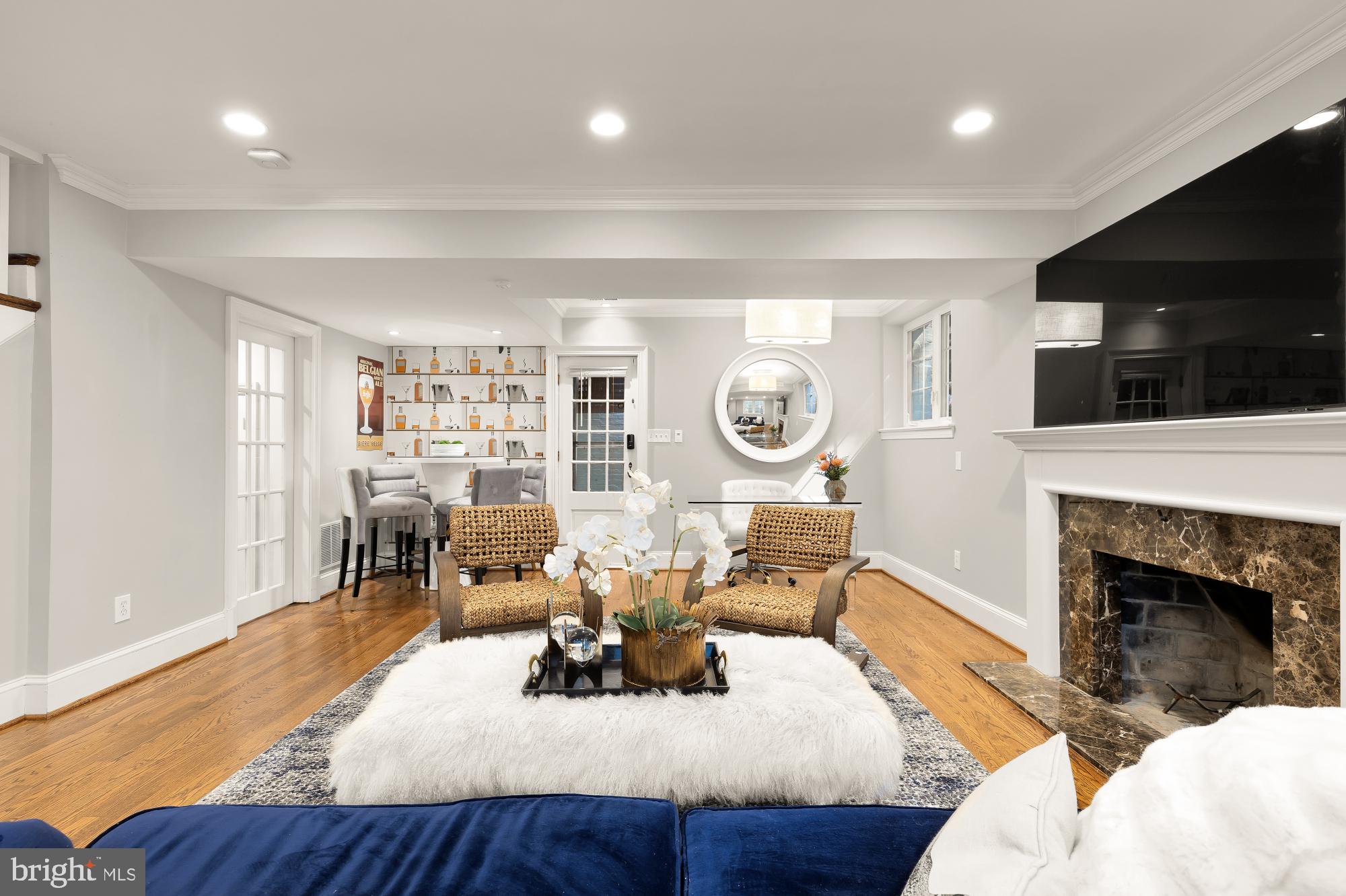 3110 Rolling Road Chevy Chase, MD 20815 - Photo 26 of 64 a living room with fireplace furniture and a flat screen tv