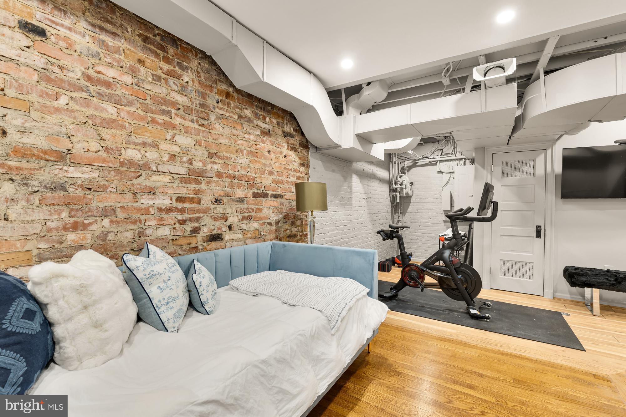 3110 Rolling Road Chevy Chase, MD 20815 - Photo 30 of 64 a bedroom with a bed and wooden floor