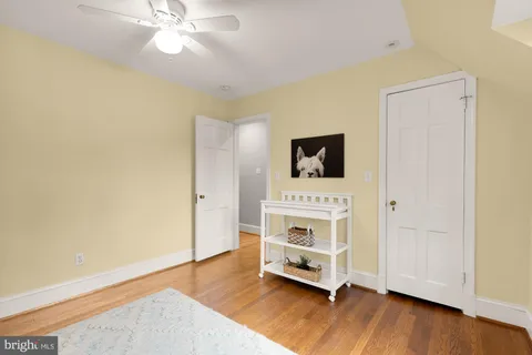a view of a bedroom with washer and dryer