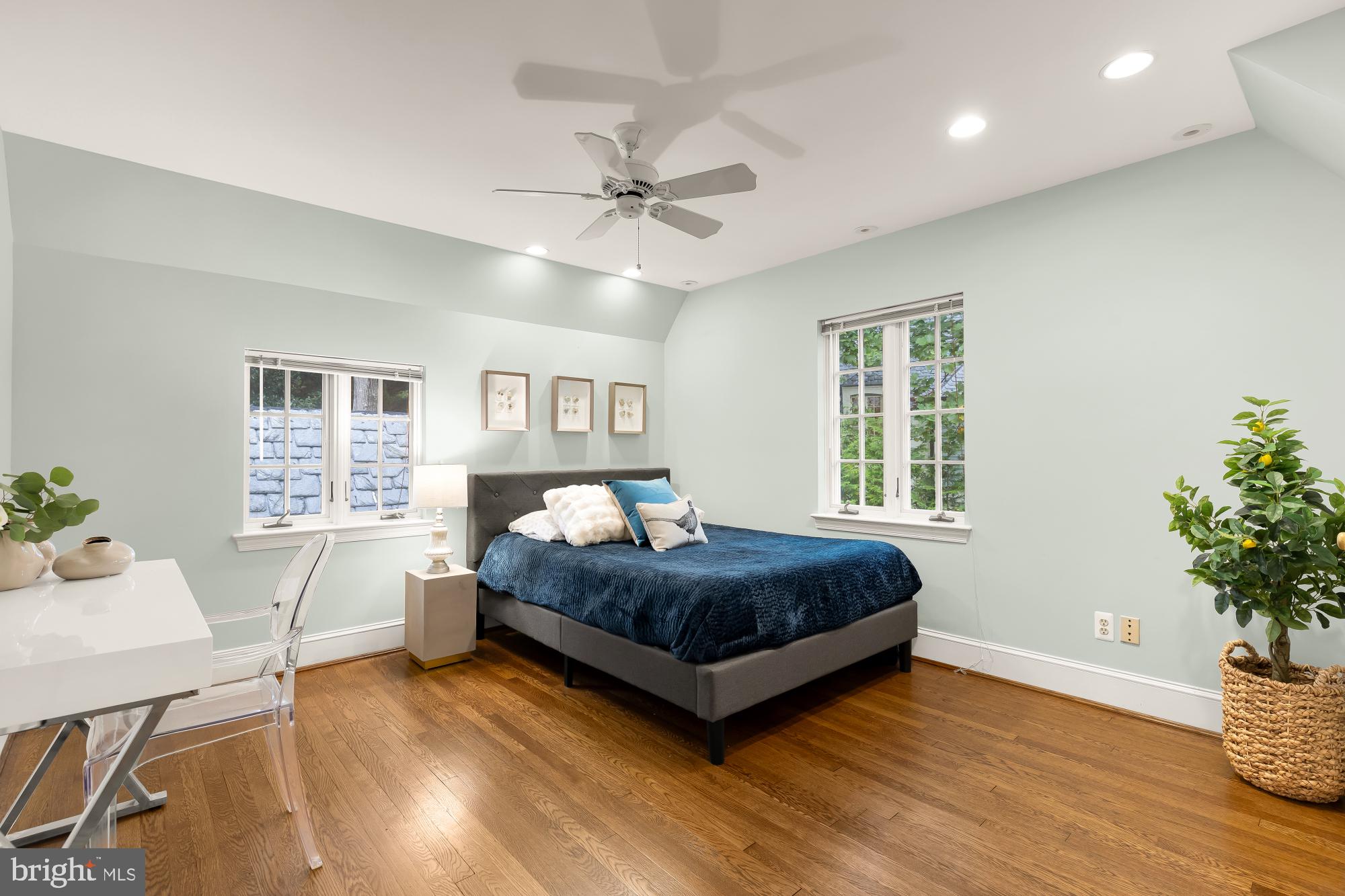 3110 Rolling Road Chevy Chase, MD 20815 - Photo 41 of 64 a living room with a bed furniture and a potted plant