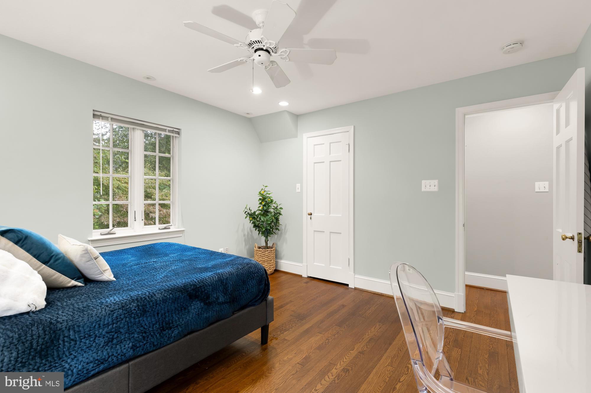 3110 Rolling Road Chevy Chase, MD 20815 - Photo 42 of 64 a bedroom with a bed and wooden floor