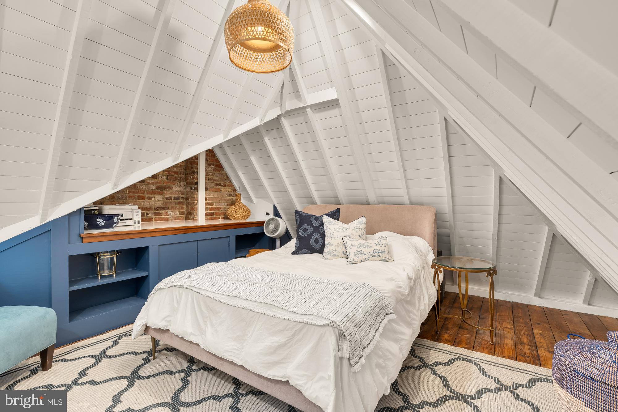 3110 Rolling Road Chevy Chase, MD 20815 - Photo 52 of 64 a bedroom with a bed and a table with wooden floor