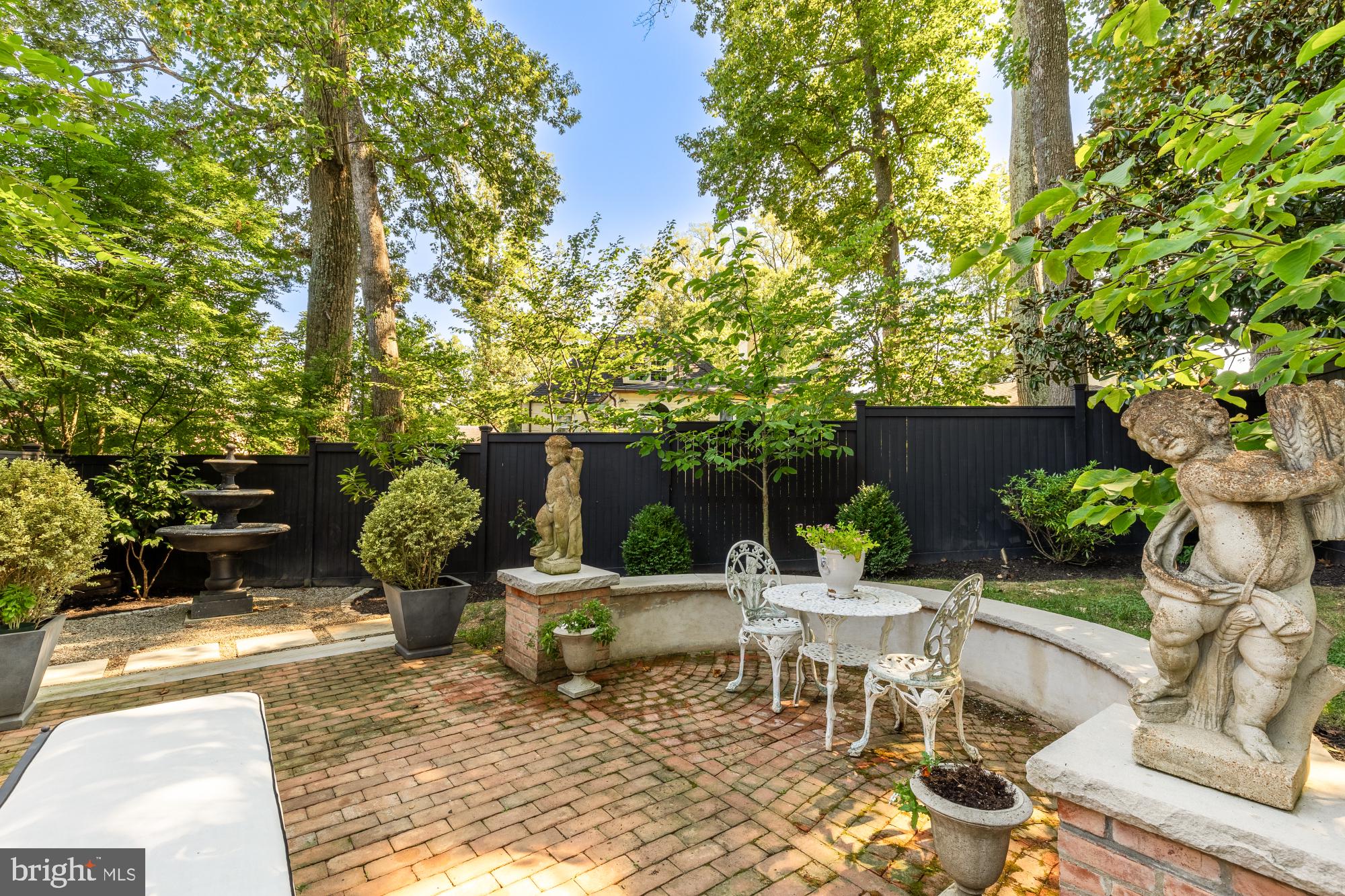 3110 Rolling Road Chevy Chase, MD 20815 - Photo 55 of 64 a view of a chairs and table in backyard