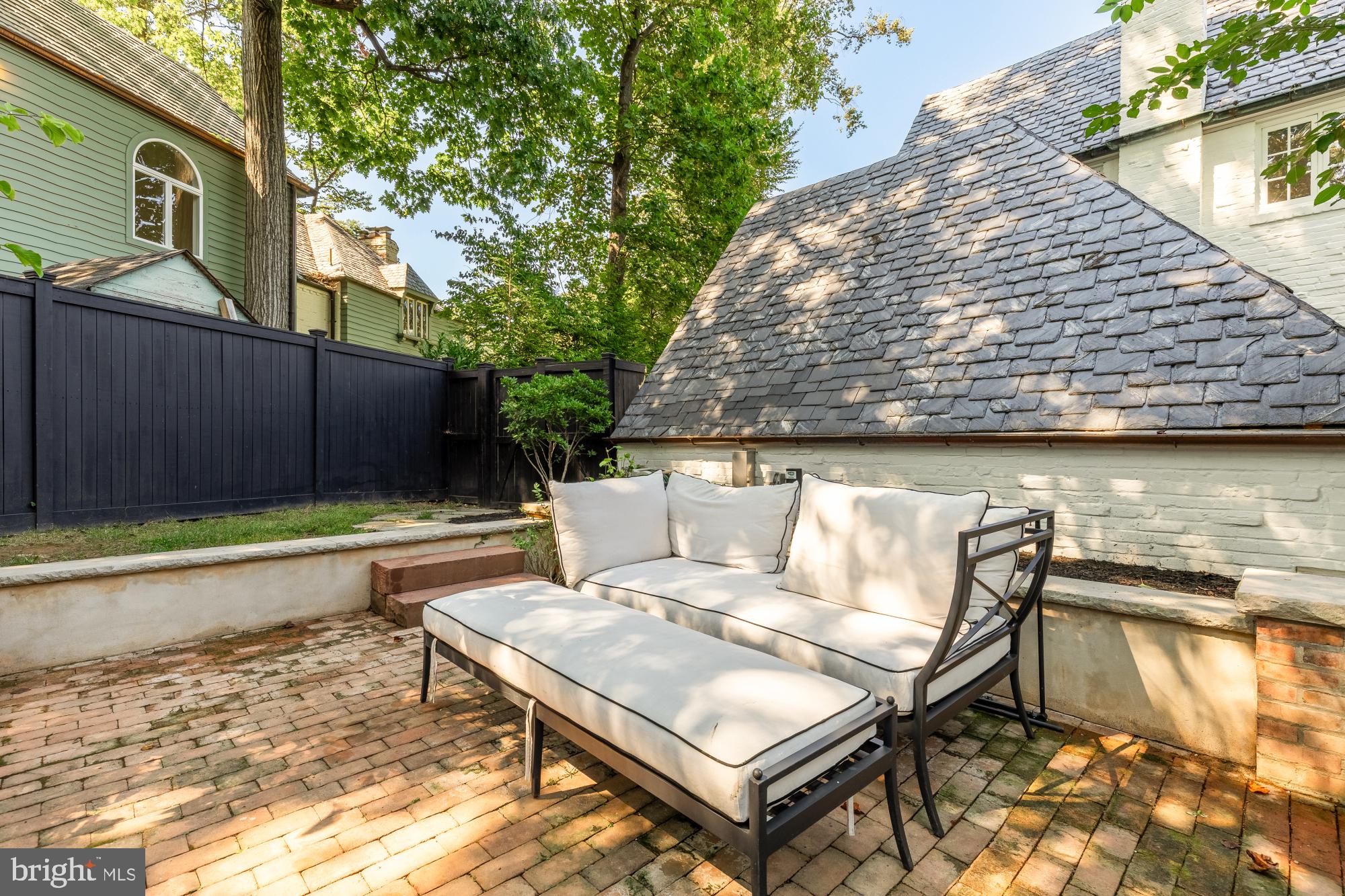 3110 Rolling Road Chevy Chase, MD 20815 - Photo 56 of 64 a view of a backyard with swimming pool and sitting area