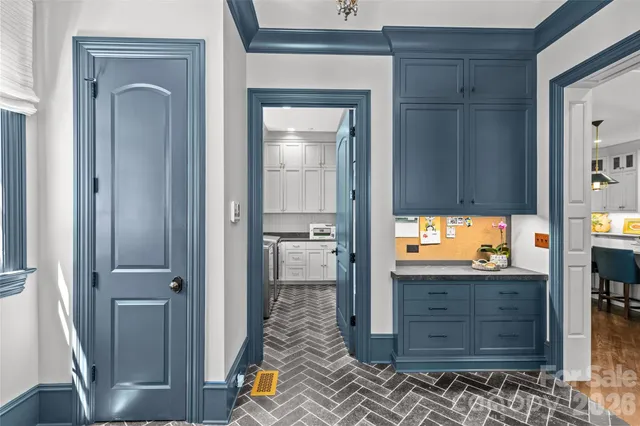 a kitchen with stainless steel appliances granite countertop a sink a stove and cabinets