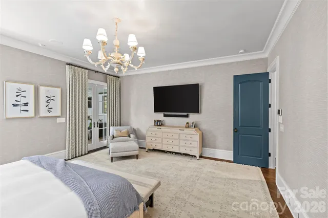 a bathroom with a double vanity sink large mirror and a bathtub