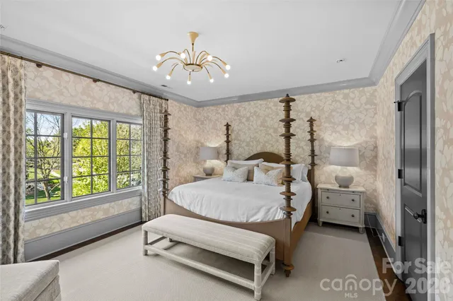 a living room with furniture and a lamp