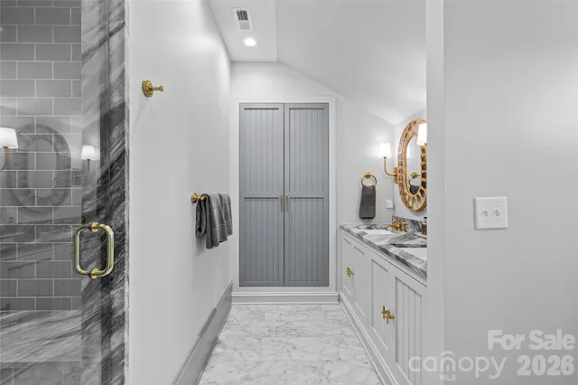 a kitchen with refrigerator and cabinets