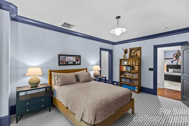 a en suite bathroom with a double vanity sink and a mirror